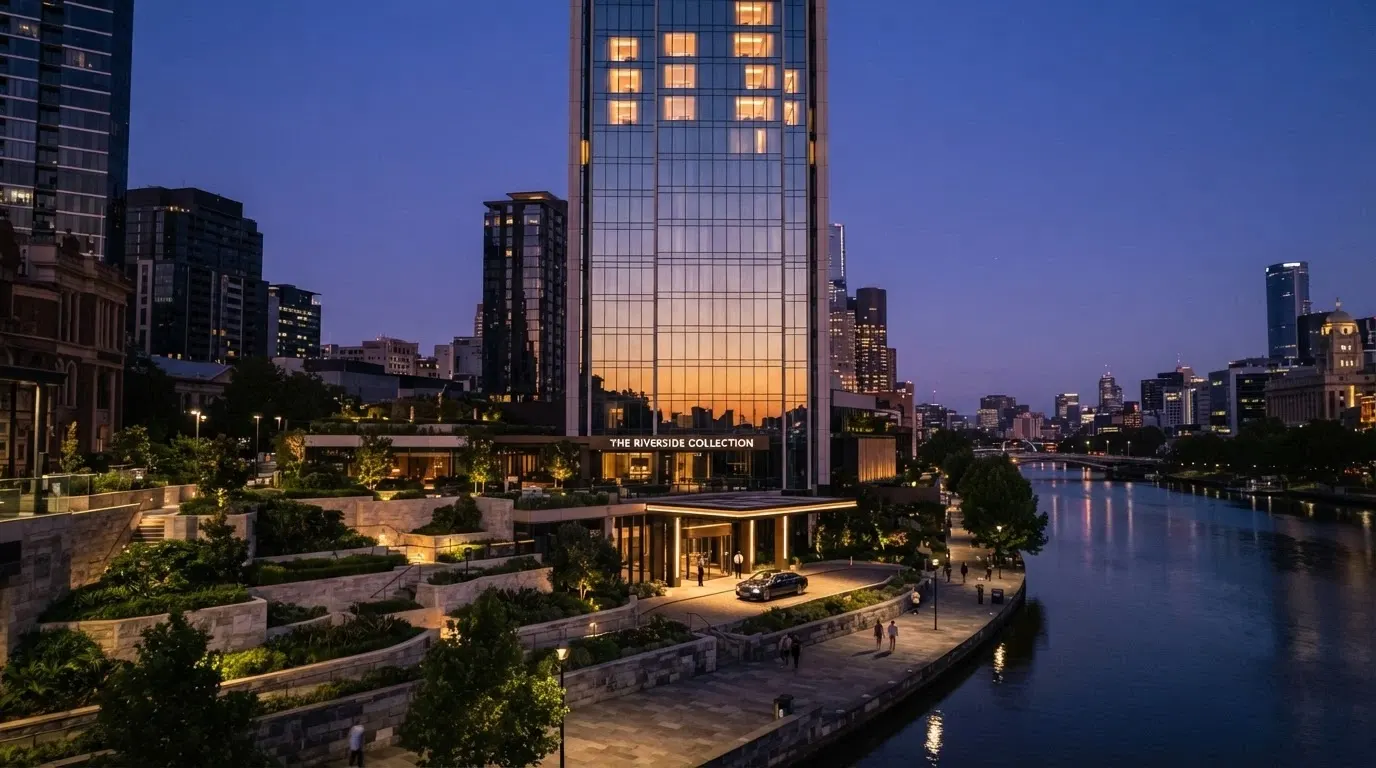 The Star Grand Hotel riverfront facade at Queen's Wharf, showing the luxury tower against the Brisbane River